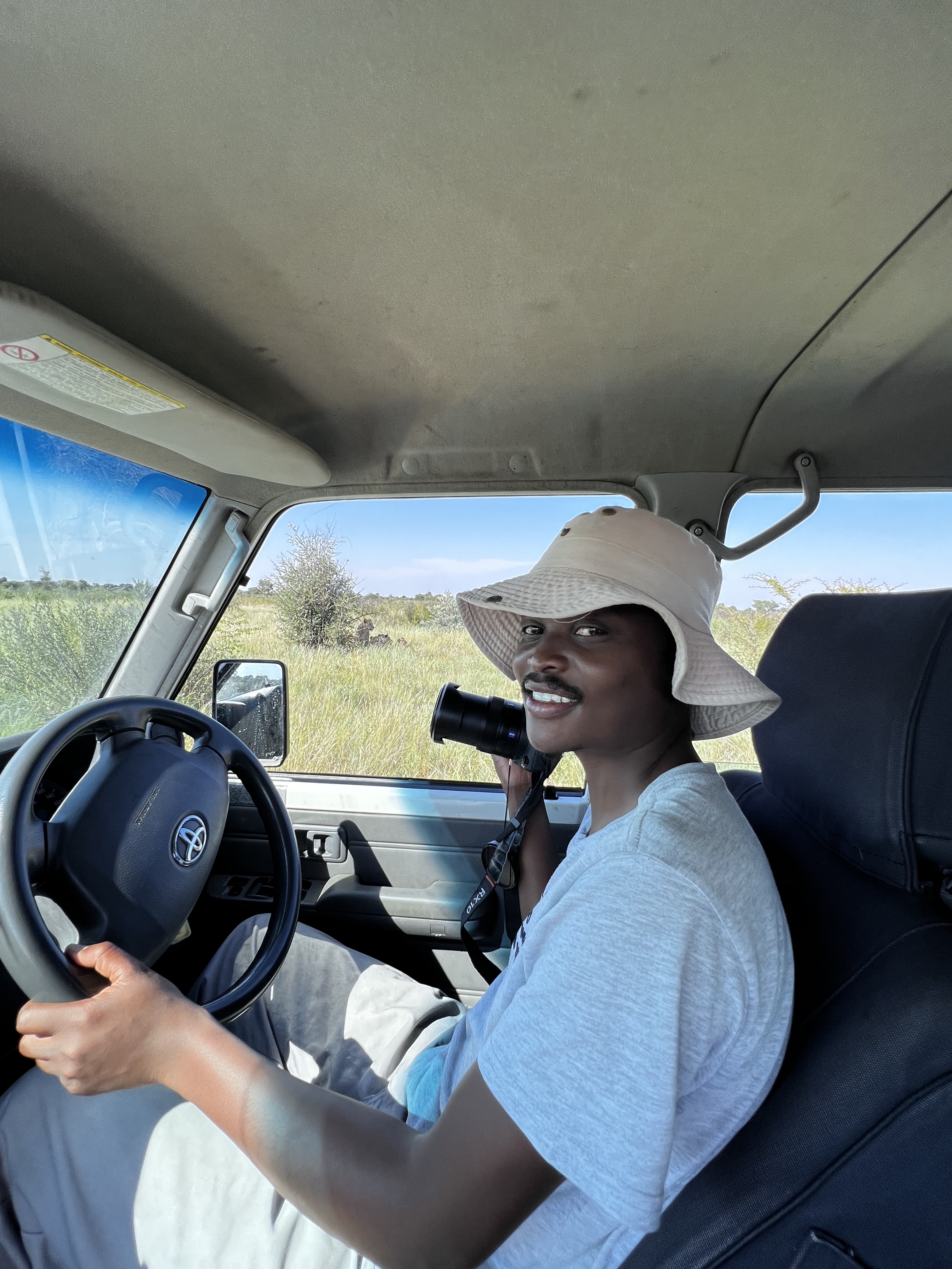 Trevor Balone collecting field data during lion research in Botswana